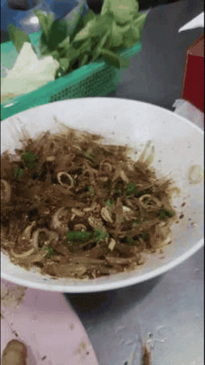 White Bowl Filled With Brown And Green Vegetable Dish GIF