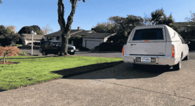 White Cadillac Parked In Driveway With California License Plate DF-290 GIF