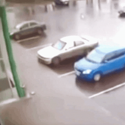 White Car And Blue Car Parked GIF