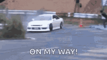 White Car Drifting Along Zigzag Road GIF