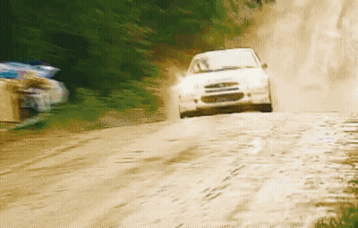 White Car Driving Down Dirt Road GIF