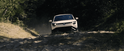 White Car Driving Down Dirt Road With Trees GIF