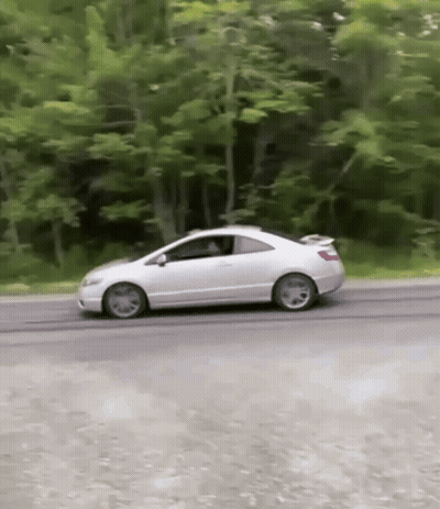 White Car Driving Down Road Near Trees GIF