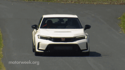 White Car Driving Down Road With Motorweek.org GIF