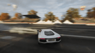 White Car Driving Down Road With Smoke GIF