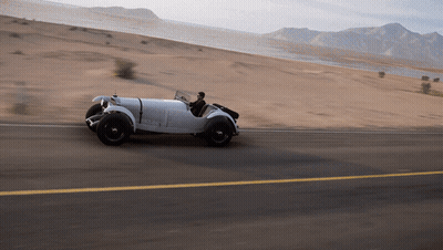 White Car Driving In Desert GIF