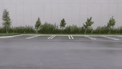 White Car Driving In Parking Lot GIF