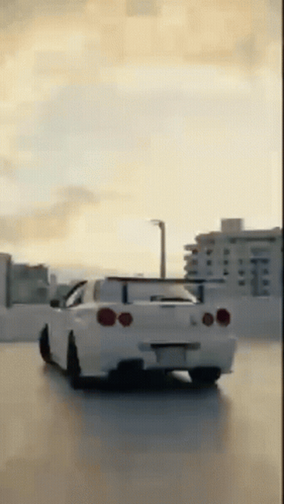 White Car Driving In Parking Lot With City Background GIF