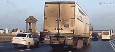 White Car Driving Next To Truck Saying GIFak.net GIF