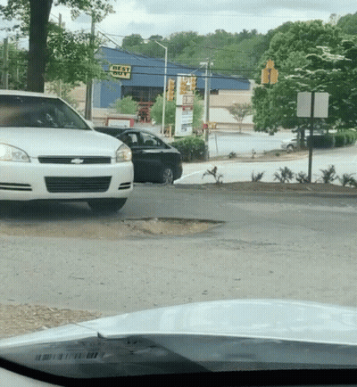 White Car Parked In Front Of Best Buy GIF