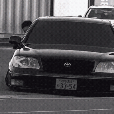 White Car With License Plate Saying JCW GIF