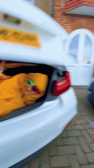 White Car With Open Trunk And JC License Plate GIF