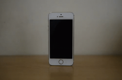 White Cell Phone On Wooden Table GIF