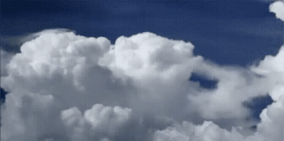 White Clouds Floating In Blue Sky GIF