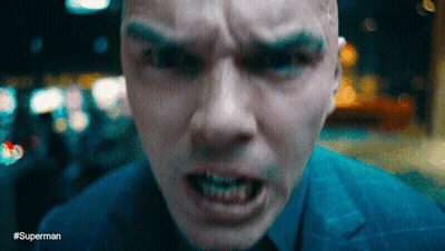 White Dog With Pink Tongue In Dark Room GIF