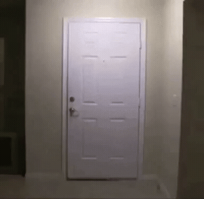 White Door Open In Hallway With Light GIF