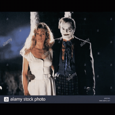 White Dress Woman Next To Joker Costume Man GIF
