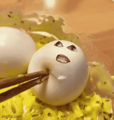 White Egg Face Picked Up By Chopsticks GIF