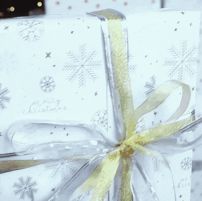 White Gift Saying Merry Christmas GIF
