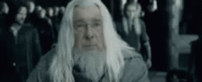 White-Haired Bearded Man Before Crowd GIF