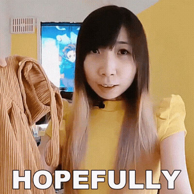 White-Haired Man In Yellow And White Jacket With Blue Tie GIF