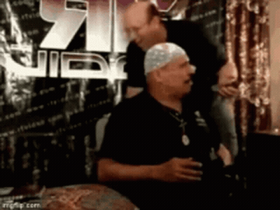 White Hat Man Next To Black Shirt Man GIF