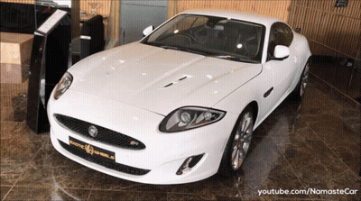 White Jaguar Sports Car In YouTube Video GIF