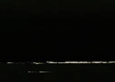 White Lightning Bolt Flying In Dark Room GIF
