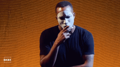 White Mask Man By Brick Wall With Bkbx GIF