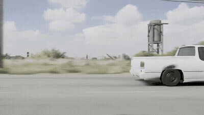 White Pickup Truck Driving Down Street GIF