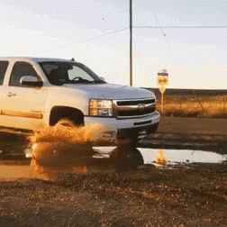White Pickup Truck Driving Through Puddle GIF