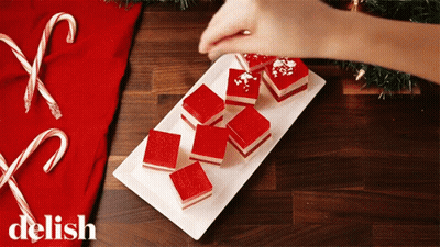 White Plate With Red Squares Saying Delish GIF