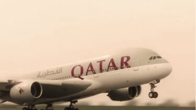 White Qatar Airplane Taking Off