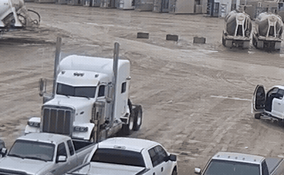White Semi Truck Parked Next To Row Of White Trucks GIF