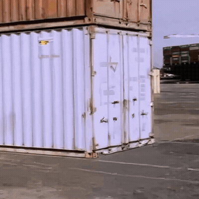 White Shipping Container With Yellow Sticker Saying A GIF