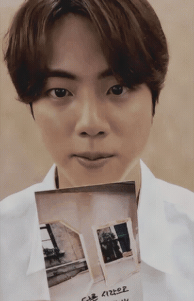White Shirt Man Holding House Picture With Korean Writing GIF