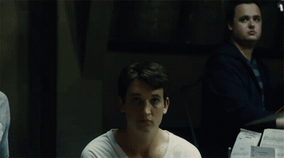 White Shirt Man Looking At Camera, Cello Player GIF