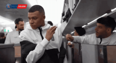White Shirt Man Next To Black Shirt Man On Plane GIF