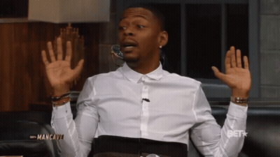 White Shirt Man On Couch Screen Saying Get GIF