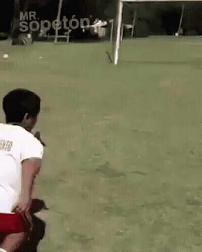 White Shirt Red Shorts Man Kneeling At Soccer Goal GIF