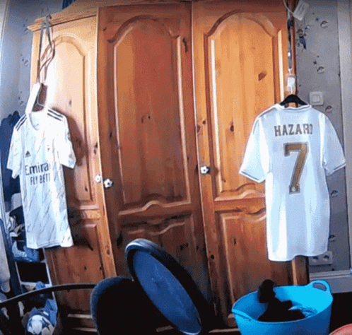 White Shirt With Number 7 In Closet GIF