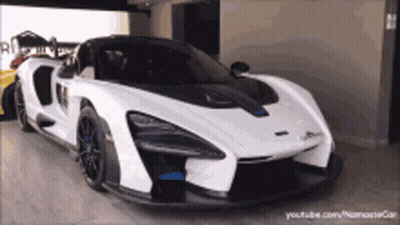 White Sports Car Next To Yellow Sports Car GIF