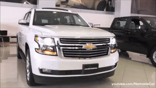 White Suburban In Showroom GIF