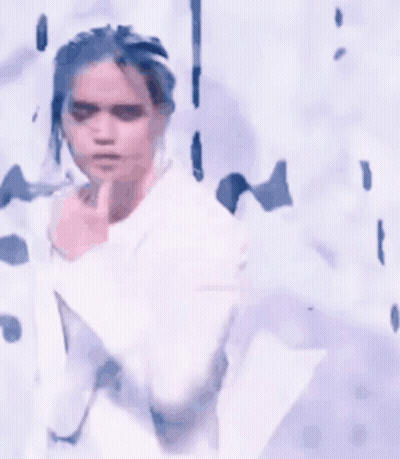 White Suit Woman Singing Into Microphone GIF
