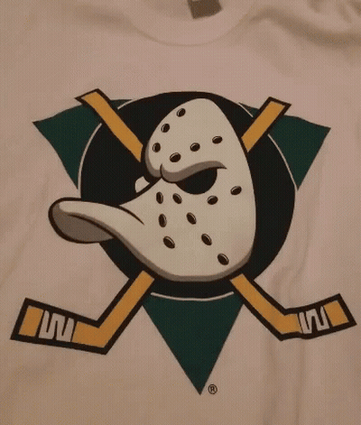 White T-Shirt With Duck And Crossed Hockey Sticks GIF