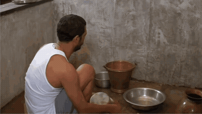 White Tank Top Man With Bowls And Bucket GIF