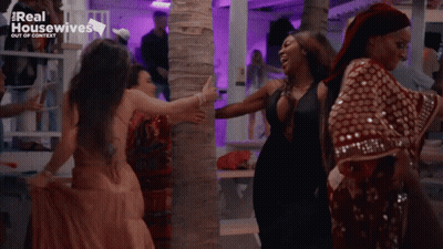 White Tank Top Woman Walking With Red Dress Woman GIF
