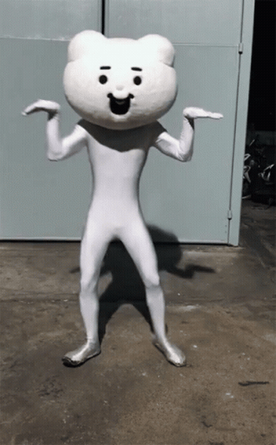 White Teddy Bear Mascot In Front Of Blue Door GIF