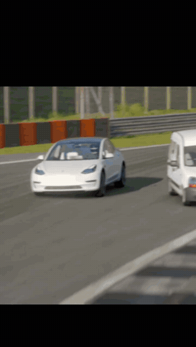 White Tesla Model 3 on Race Track with White Van
