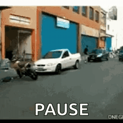 White Truck Parked In Front Of Building Saying Pause GIF